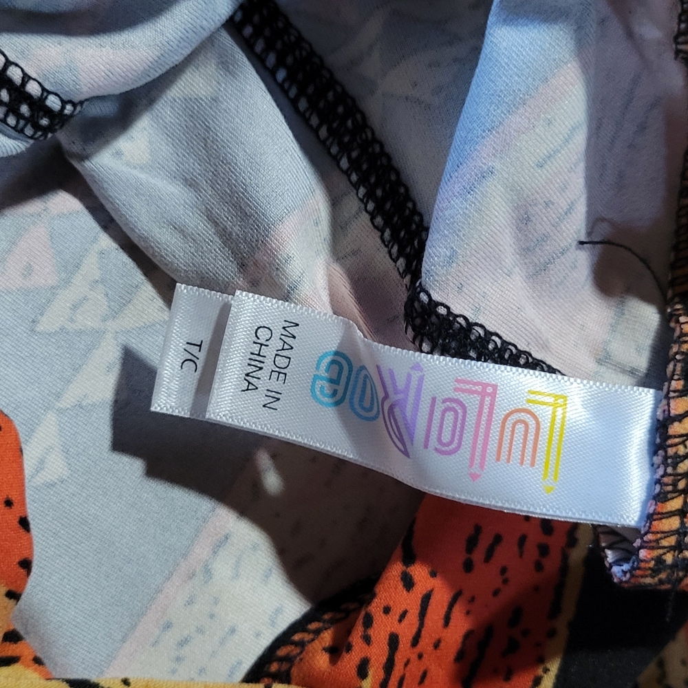 LuLaRoe Black Leggings with Orange & Yellow Tribal Accents - Picture 4 of 4